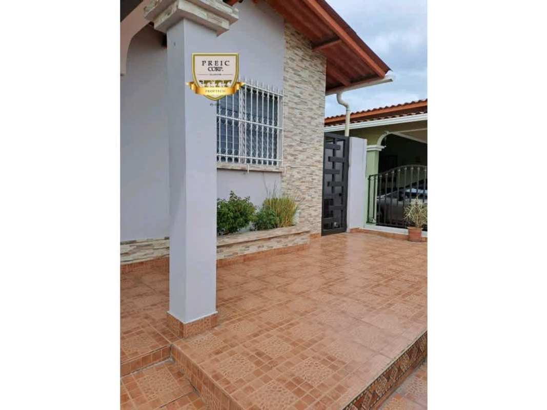 Modern exterior with tile porch, stone accent wall, decorative columns in PH Lomas del Golf Brisas del Golf