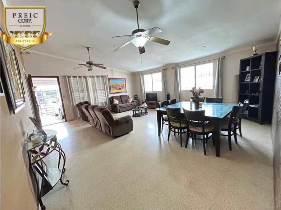 Open living dining area with neutral tile floor, ceiling fans, large windows PH Lomas del Golf Brisas del Golf