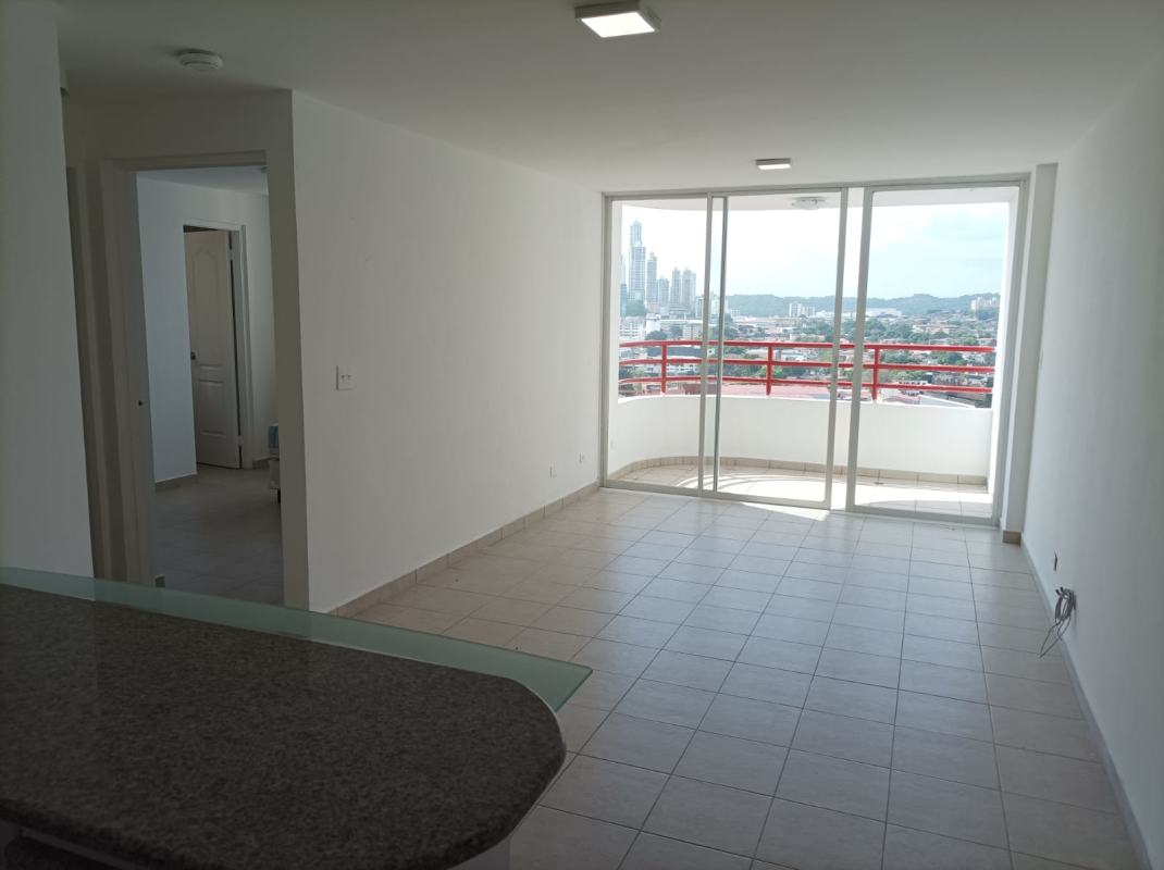 Open plan living area with large sliding doors to balcony and city view in Plaza Marquez Panama