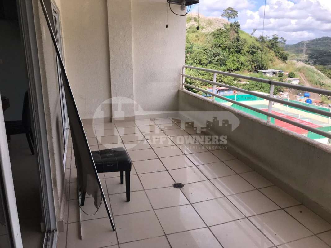 Spacious living room with large windows and ceramic floors at PH Altamira Gardens Ancón Panama