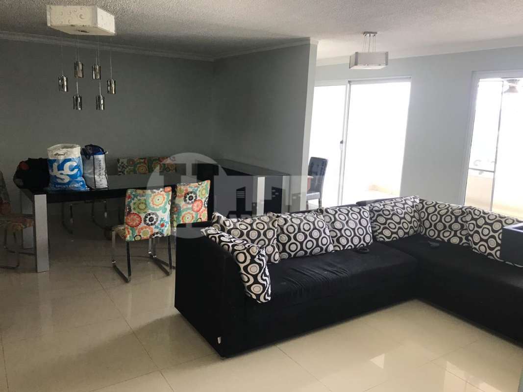 Dining room with pendant lighting and colorful chairs at Altamira Gardens Panama