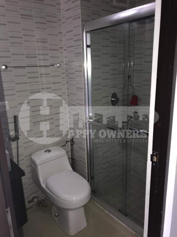 Outdoor pool with water features, bridge, and gardens at PH Altamira Gardens Panama City