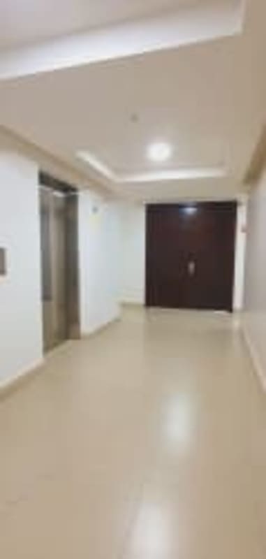 Modern lobby and landing with elevator, entrance door in PH Oceanaire Punta Pacifica Panama