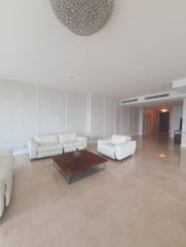 Modern living and dining area with panoramic Pacific Ocean and skyline views with marble floors Grand Tower Punta Pacifica Panama