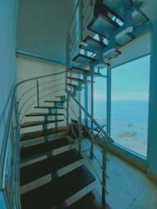 Luxury bathroom with double vessel sinks, glass shower enclosure in Loft 41 Panama City