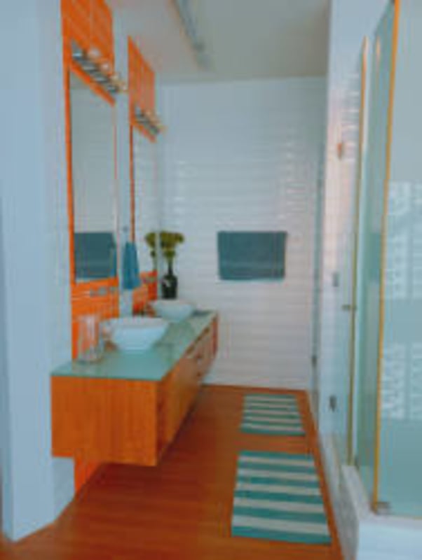 Elegant spiral staircase near panoramic window overlooking Pacific Ocean in Loft 41 Punta Pacifica apartment