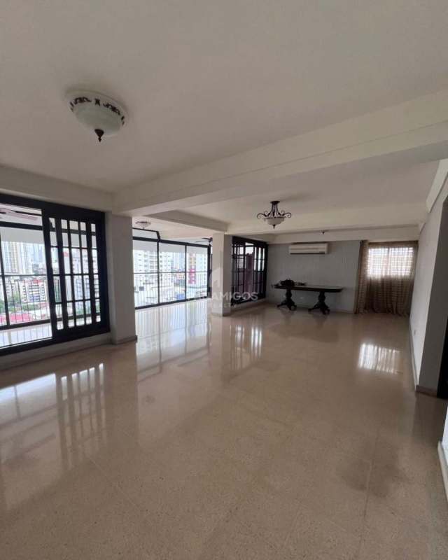 Large living room with floor-to-ceiling windows and balcony in PH Carmel El Carmen Panama City