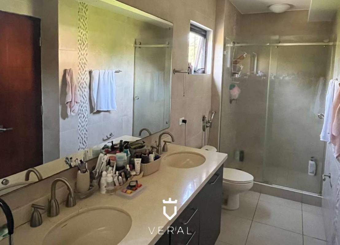 Modern bathroom with double sink vanity, marble finishes at Embassy Club Clayton Panama