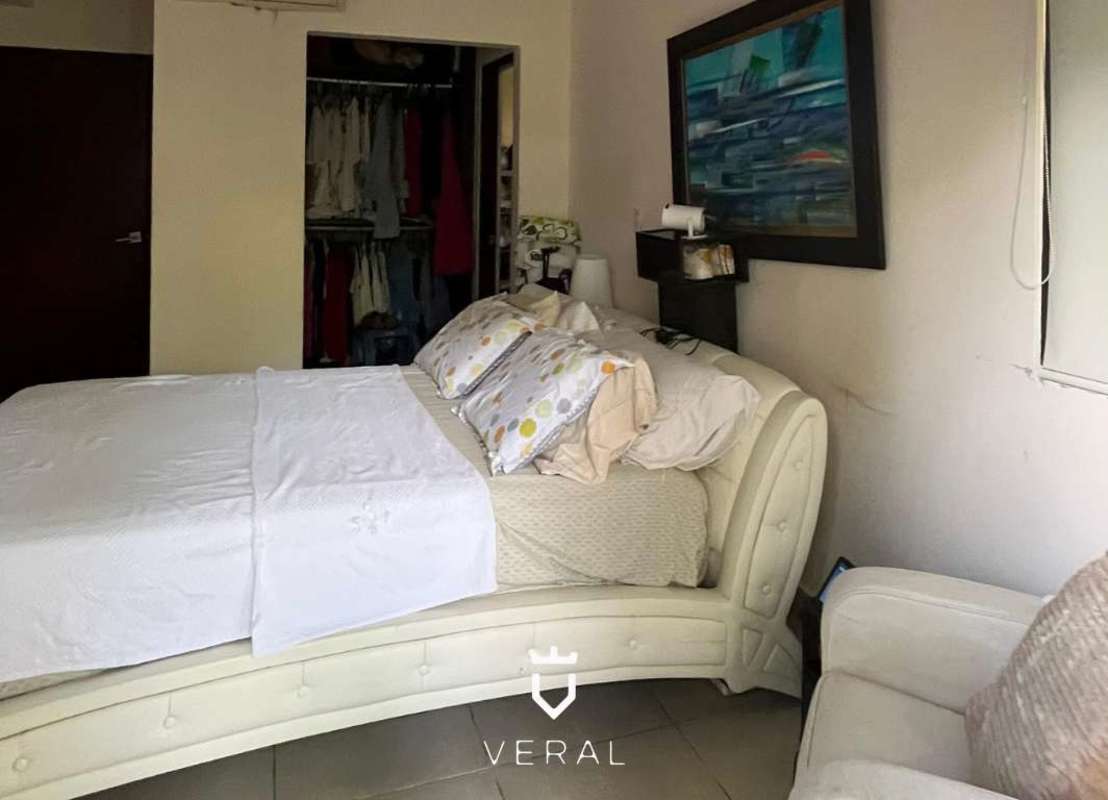 Kitchen with granite countertops, dark wood cabinets, and stainless appliances Embassy Club Clayton Panama