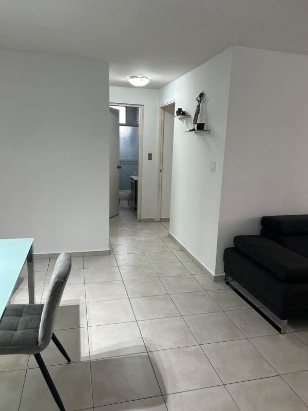 Second bedroom with tiled floor, AC, ceiling fan, closet furnished in San Francisco Panama City apartment