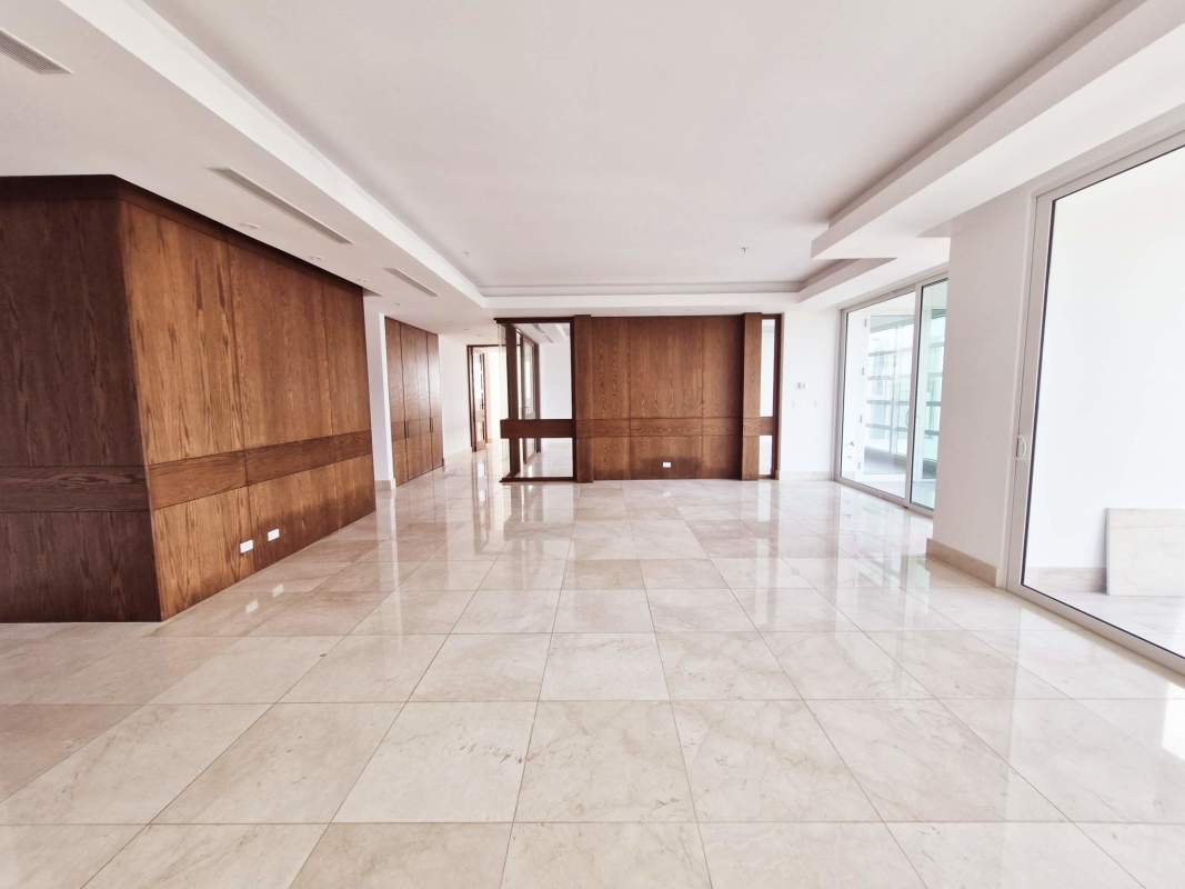 Elegant open den or family room with wood doors, marble floors at PH Aria Costa del Este Panama