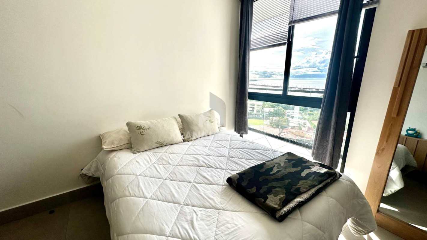 Bright bedroom with large window, natural light and modern finishes at PH Victory Wellness Coco del Mar Panama