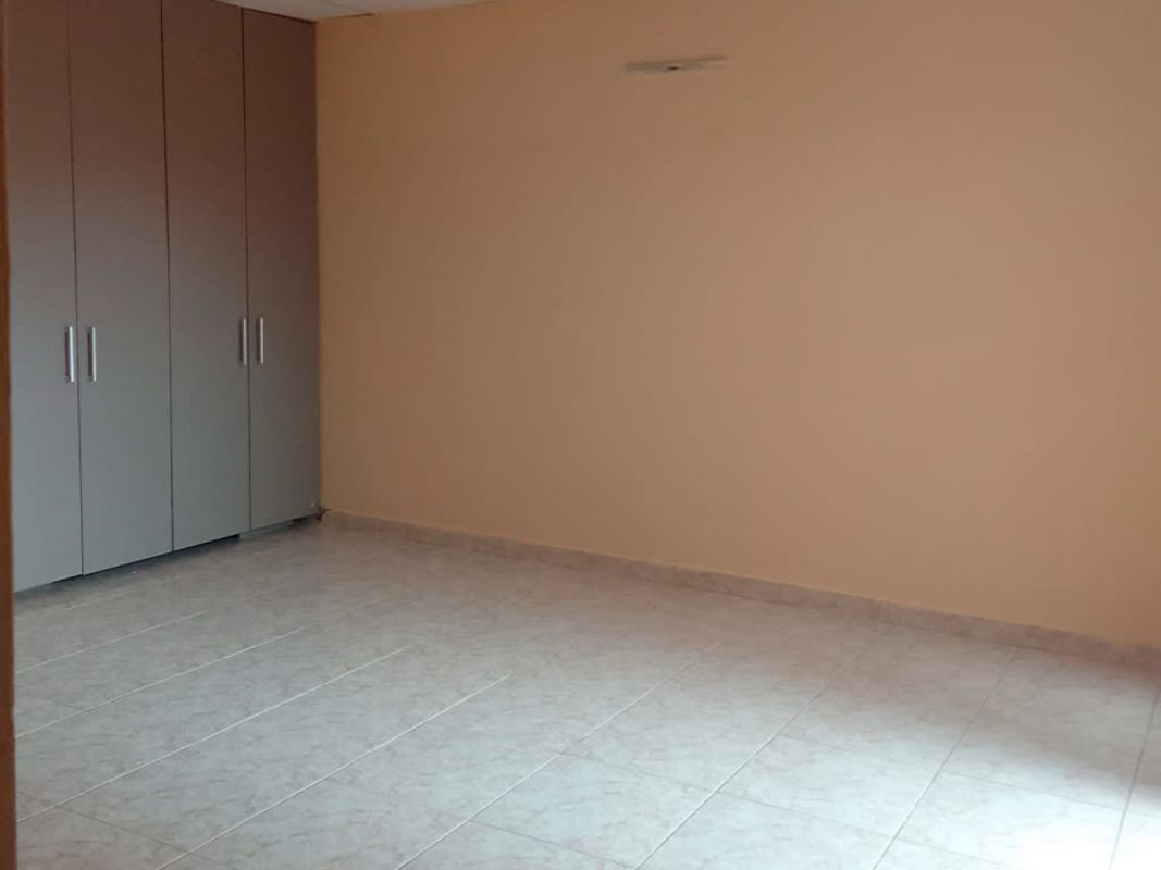 Empty bedroom with built-in wardrobe tiled floor Villa Zaita house Panama