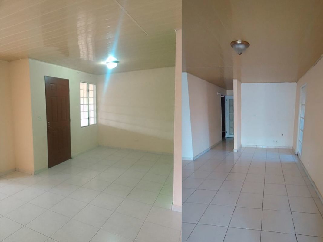 Bright living room with tiled floor, brown door, neutral walls at Villa Zaita house Panama
