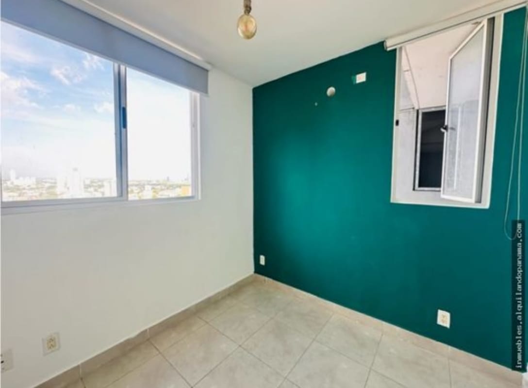 Bright minimal bedroom with closet and large window in PH Gaudi apartment for rent Panama