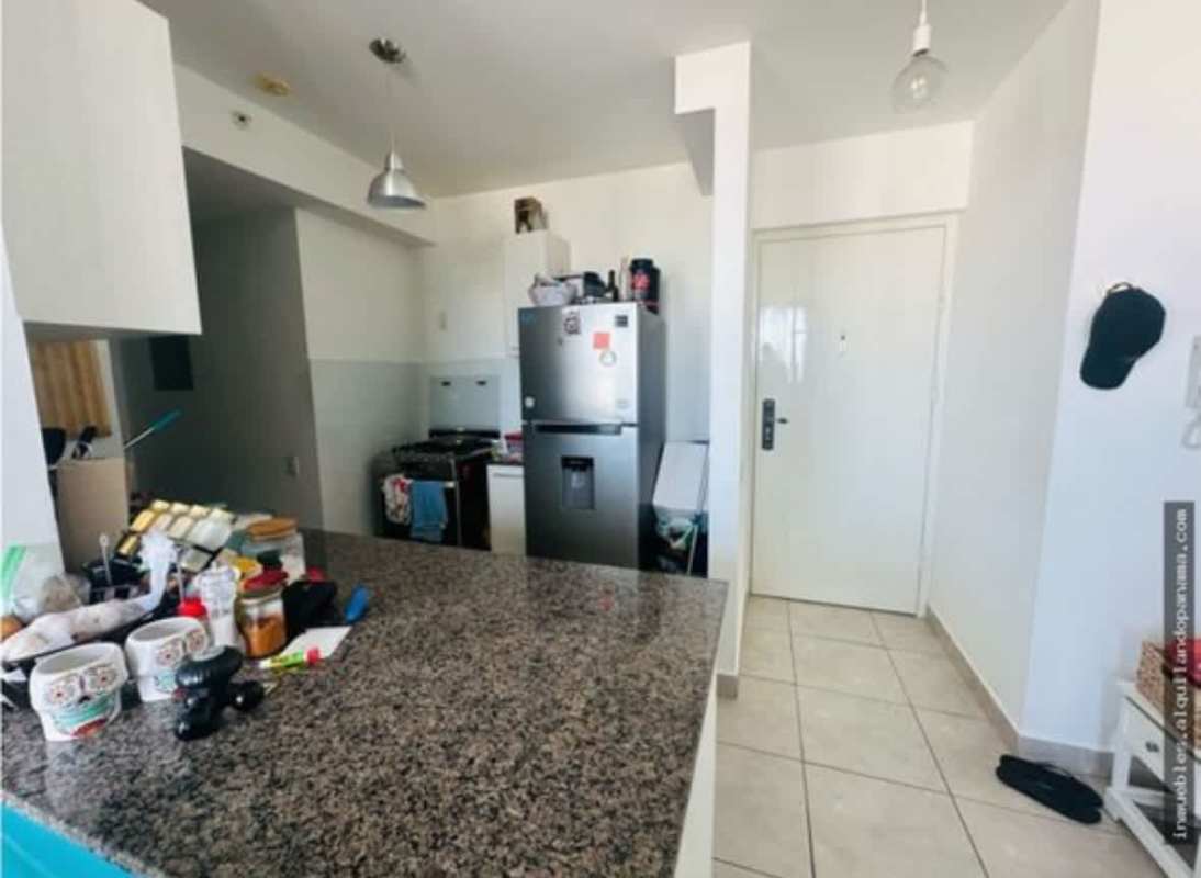 Minimalist kitchen with granite countertops, fridge and stove at PH Gaudi Panama