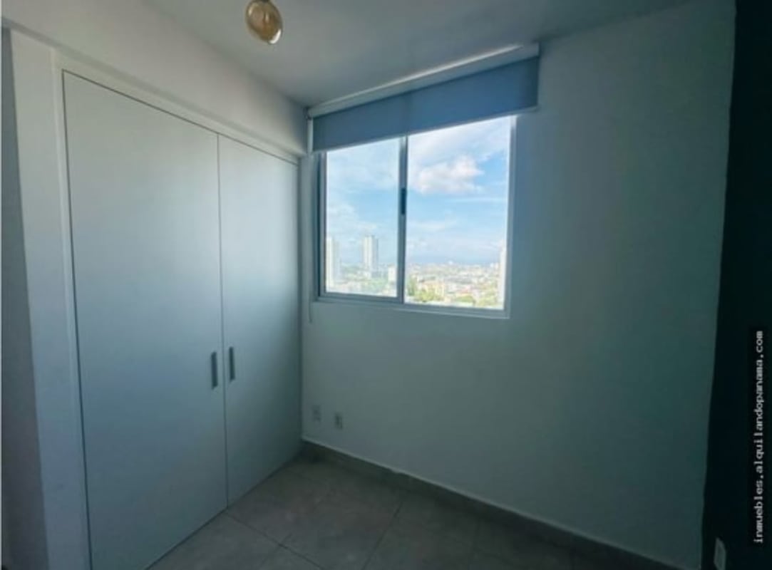 Small bedroom with closet and city window view PH Gaudi apartment Panama for rent
