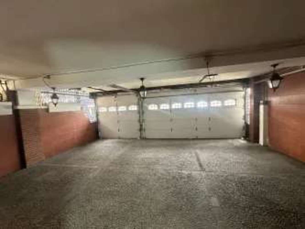 Garage interior with brick walls and double doors in Obarrio real estate Panama City