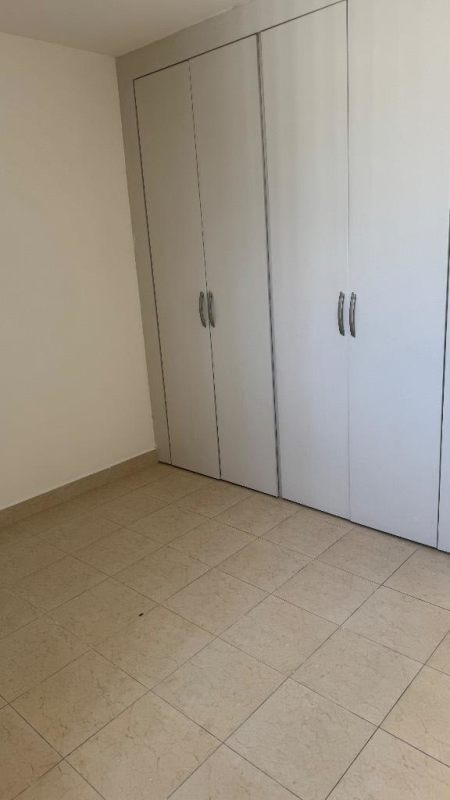 Bedroom with window split AC built-in closet tiled floor PH Plaza Edison Panama City apartment