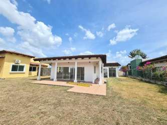 Large backyard garden with fence tropical plants in Panama Nueva Gorgona beach house