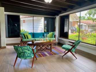 Open living dining with wood ceiling villa Bouganvilla in Coronado Golf Panama