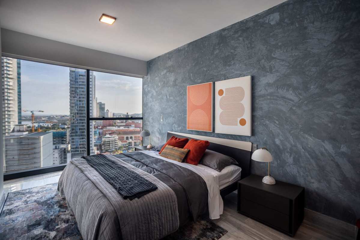 Bedroom with large window, skyline view and modern interior Nuovo by Armani Casa Panama