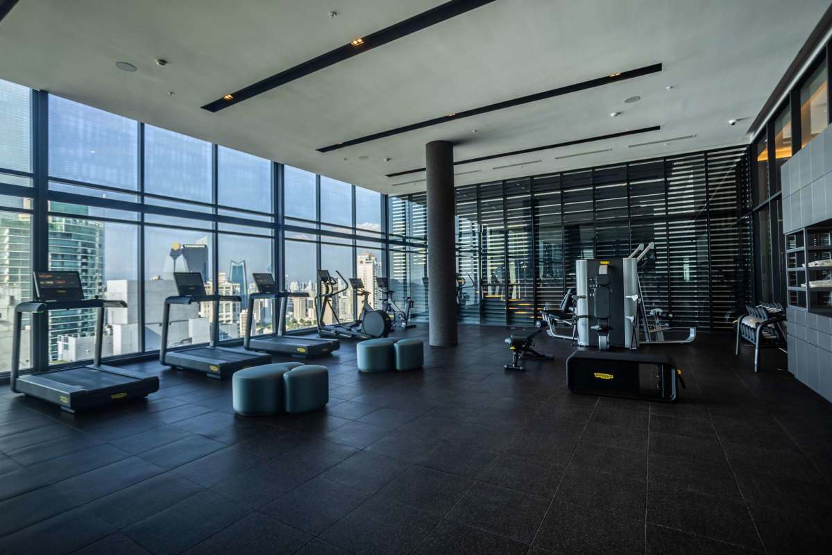 Indoor spa with lounge chairs, Jacuzzi, panoramic city and ocean views at Nuovo by Armani Casa