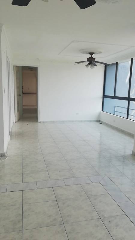 Living and dining room with ceiling fan, large windows, balcony access in PH Mirabel Punta Paitilla