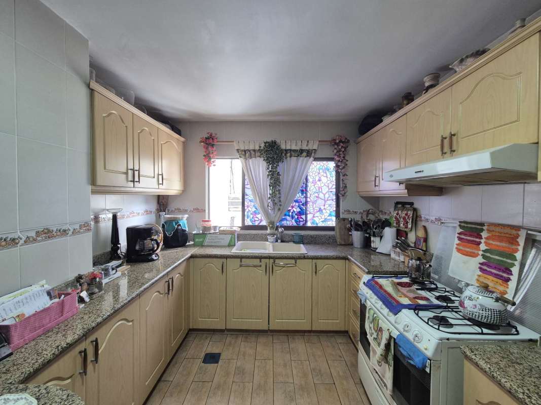 Infinity pool with lounge deck overlooking Pacific Ocean at PH Agua Marina in Coco del Mar