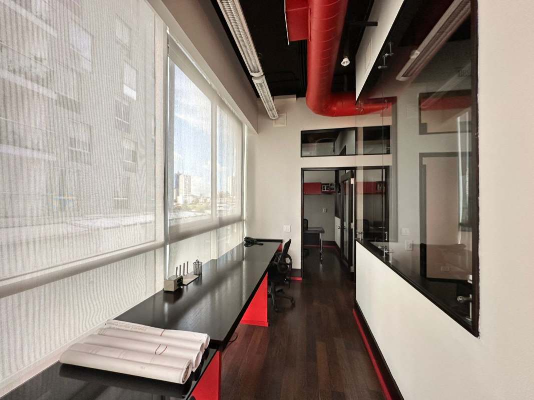 Glass-walled office space with skyline views at PH BICSA Tower Panama City