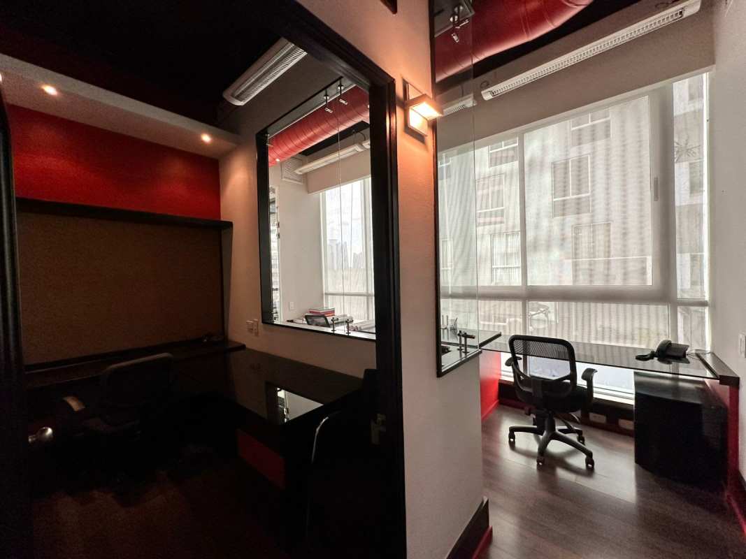 Meeting room with artwork, pendant light, large table in PH BICSA Tower Panama office for sale