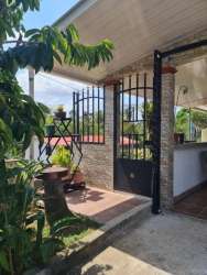 House facade with metal gate and driveway near Wesland Mall Panama