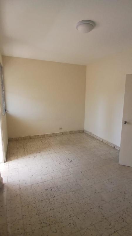 Tiled bathroom with walk-in shower and pedestal sink at Mercedes Elidas Carrasquilla