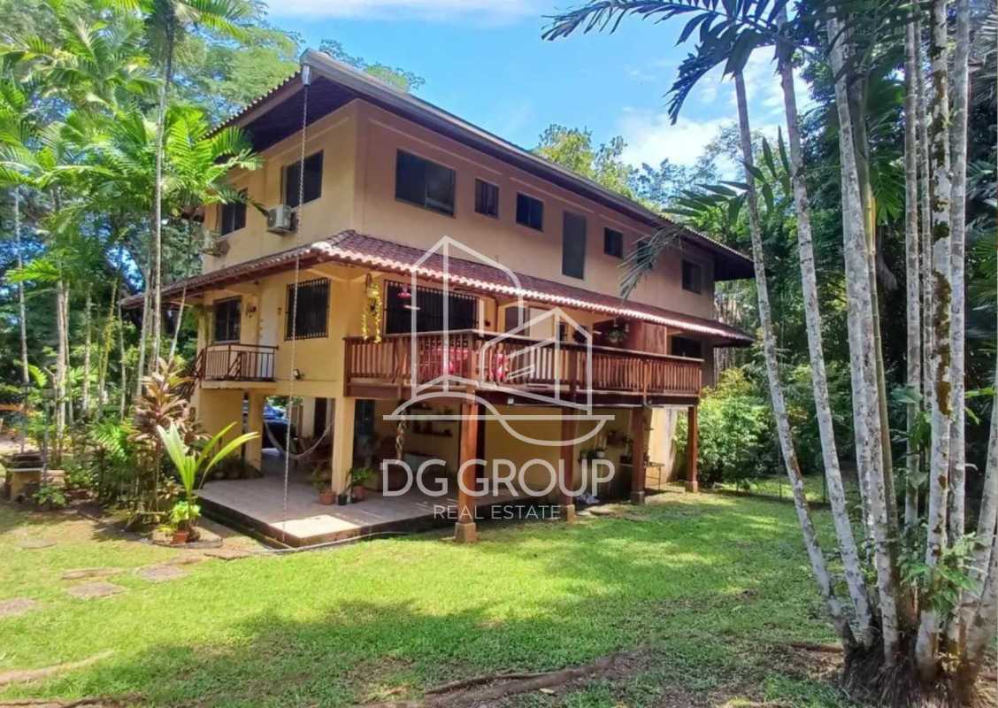 Tropical house elevated wrap-around balcony lush yard rental Clayton Panama