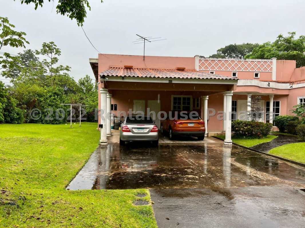 Comfortable bedroom with window, dresser, and AC unit in Las Cumbres Panama city house