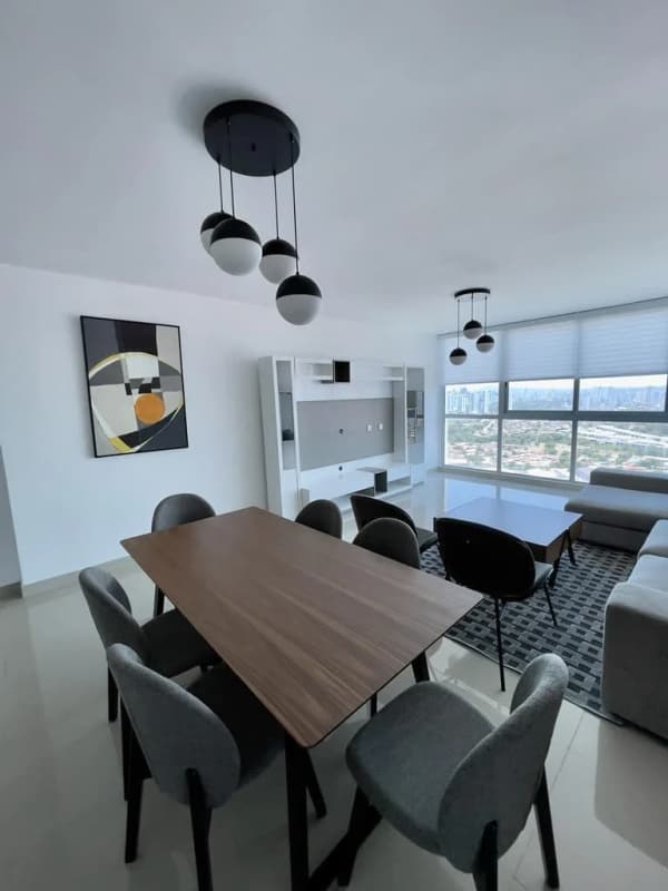 Modern kitchen with granite countertops, stainless appliances, breakfast bar at PH Top Tower Costa del Este Panama