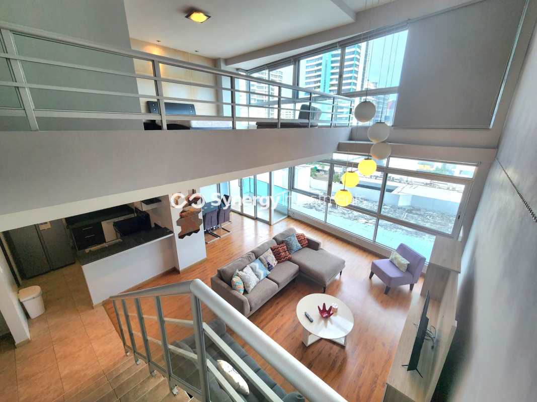 Open concept kitchen with granite countertop and appliances in PH BICSA loft apartment Panama City