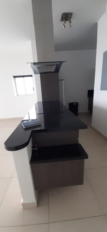 Spacious living room with glass doors opening to balcony and ocean view in PH Rivage Avenida Balboa Panama