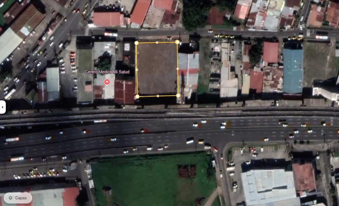 Street view of empty lot with fencing located on secondary road near Metro station Pedregal Panama