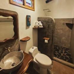 Outdoor pool with tropical landscaping at hotel for sale in Playa Santa Catalina Panama