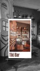 Tiki style bar with wood carvings at hotel restaurant Playa Santa Catalina Panama