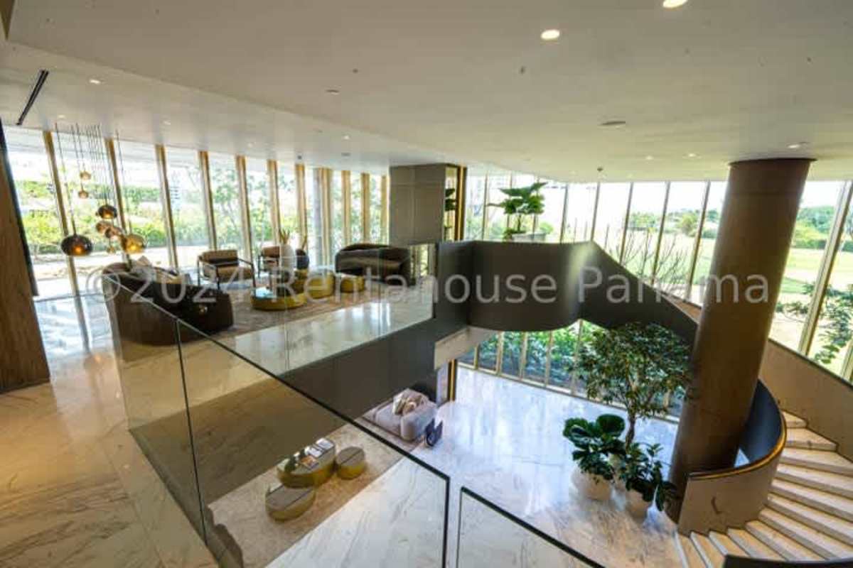 Double height lobby with marble floors, modern furniture and lighting PH La Majestic Santa María