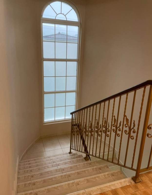 Spacious modern kitchen with granite countertops, stainless appliances and natural light in PH Rainforest Villas