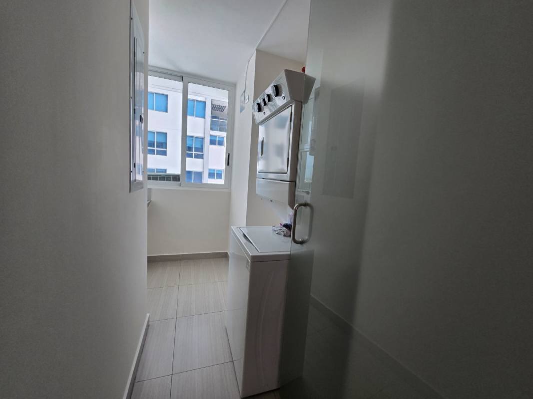 Master bedroom with built-in wardrobe and panoramic windows at PH Asia condo Panama