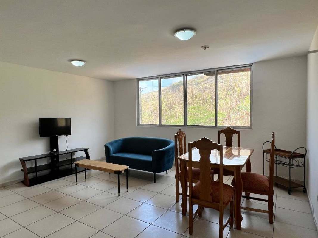 Bathroom with granite vanity sink glass shower enclosure ceramic tiles apartment Mallorca Park Village San Miguelito