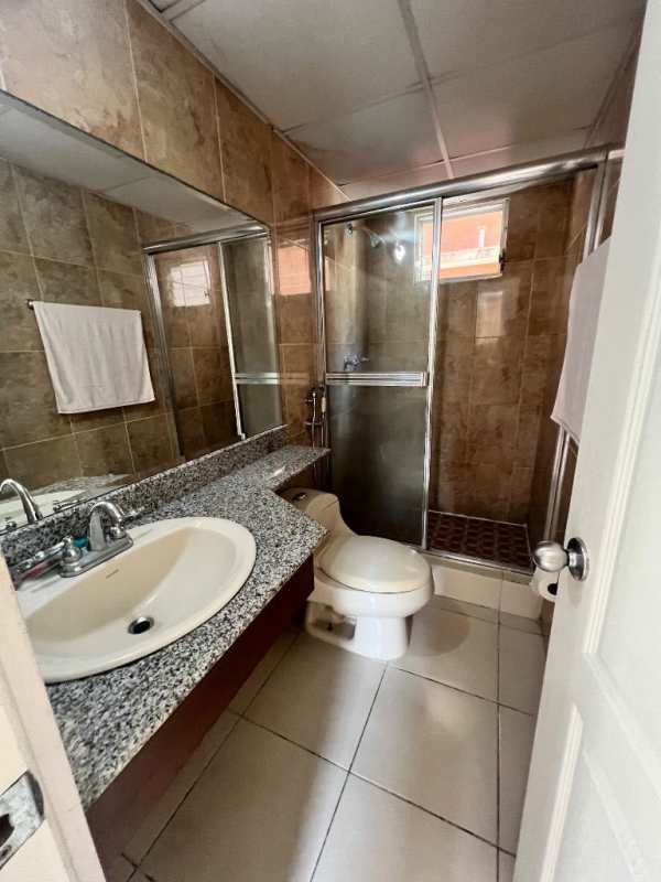 Spacious living room with balcony access natural light ceramic tile floors Mallorca Park Village San Miguelito Panama