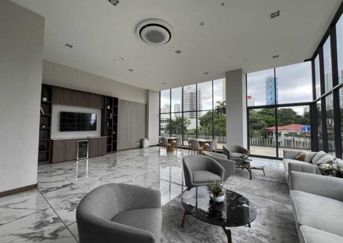 Large duplex lounge and dining area with natural light at Prestige Bella Vista in Panama City