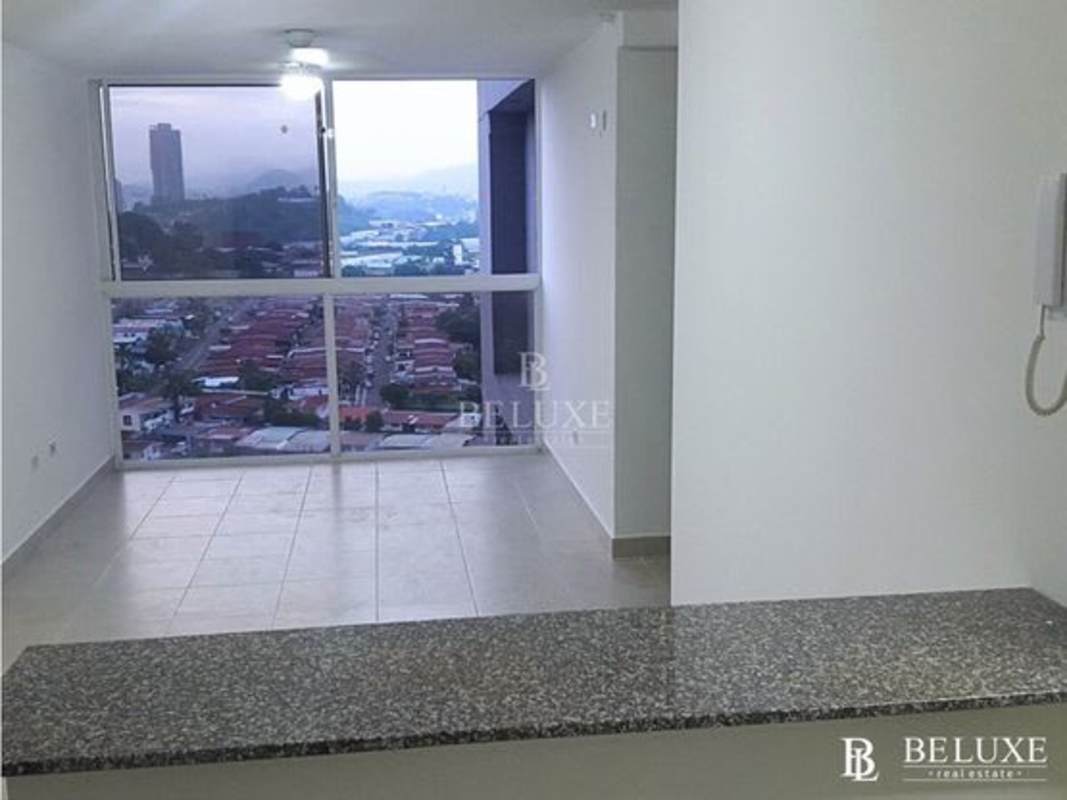 Bedroom with large window and city view in Vista Marina Towers Panama City rental apartment