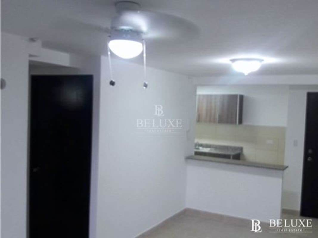 Kitchen with granite-style counters, cabinets, and tile backsplash at Vista Marina Towers, Panama City