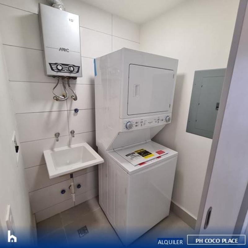 Laundry room with washer dryer, water heater inside PH Coco Place Panama City